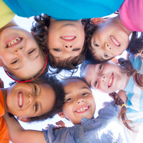 Children in group huddle